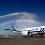 A Boeing 787 operated by All Nippon Airways taxis under a rainbow created by fire trucks at Seattle-Tacoma International Airport on Oct. 1, 2012, during an official welcome ceremony after it landed on the first day of service on ANAs Seattle-Tokyo route. (AP Photo/Ted S. Warren)