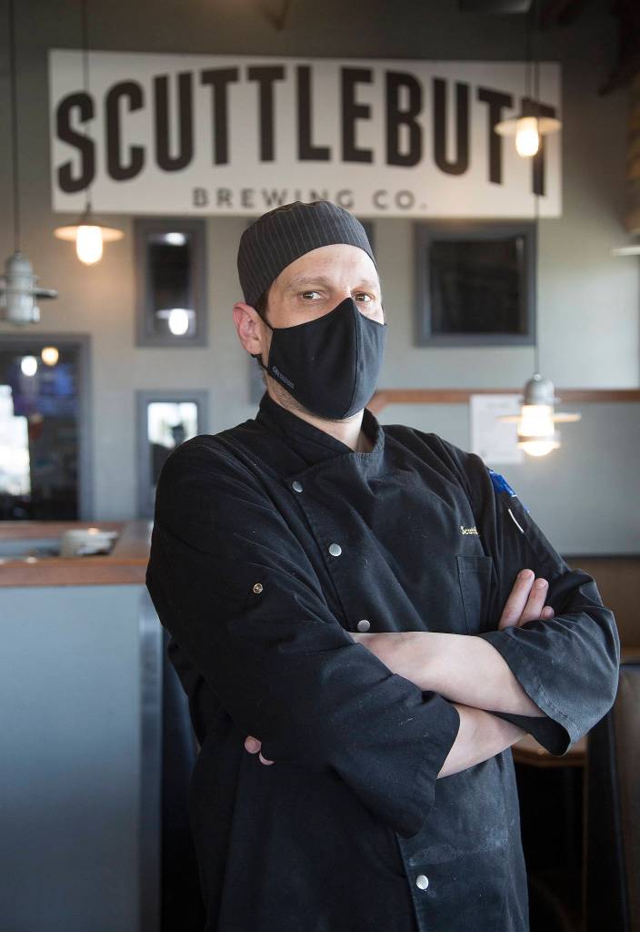 Scuttlebutt Brewing Co. chef Jeremiah Marleau says Everett Restaurant Month was the perfect time to put the massive Triple Threat Burger on Scuttlebutts menu. (Andy Bronson / The Herald)