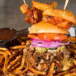 Scuttlebutt Brewing Company chef Jeremiah Marleau created The Triple Threat burger with three meats and ghost pepper jack cheese among the ingredients. Shot on Monday, March 8, 2021 in Everett, Washington.  (Andy Bronson / The Herald)