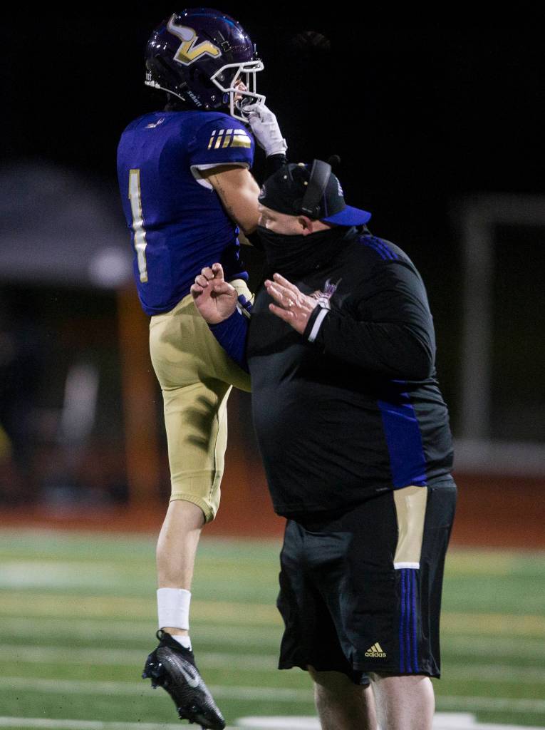 Lake Stevens Gabe Ramsey celebrates after one of his two interceptions. (Olivia Vanni / The Herald)