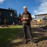 Tom Campbell, who as a legislative staffer, helped write the original 1990 Growth Management Act, stands in the  eco-friendly subdivision called Clearwater Commons on Tuesday, March 9, 2021 in Bothell, Washington. House Bill 1099, which would update Washingtonճ Growth Management Act, moves to the Senate after House approval. Campbell wants Snohomish County to move ahead with climate-friendly regulations, in parallel if not ahead of updated state law. (Andy Bronson / The Herald)