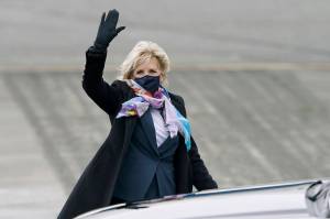 First lady Jill Biden waves after she arrived at Joint Base Lewis-McChord on Monday. On Tuesday, shell go to Naval Air Station Whidbey Island. (AP Photo/Ted S. Warren)