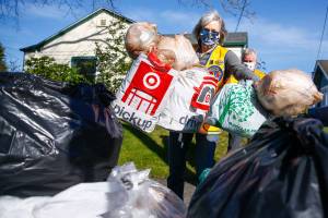 Renee Dierling adds plastic bags to the collection pile Friday afternoon in Snohomish on March 12, 2021. (Kevin Clark / The Herald)