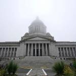 The Legislative Building is shown partially shrouded in fog at the Capitol in Olympia in January. (AP Photo/Ted S. Warren, File)