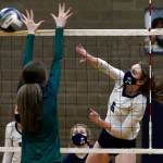 Arlingtons Malia Shepherd spikes Thursday night at Arlington High on March 11, 2021. (Kevin Clark / The Herald)