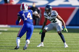 Seattle Seahawks cornerback Quinton Dunbar (22) covers Buffalo Bills wide receiver Stefon Diggs (14) during the first half of an NFL football game, Sunday, Nov. 8, 2020, in Orchard Park, N.Y. (AP Photo/Adrian Kraus)
