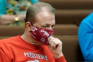 Initiative promoter Tim Eyman listens during a session of Thurston County Superior Court, Wednesday, Feb. 10, 2021, in Olympia, Wash. Eyman, who ran initiative campaigns across Washington for decades, will no longer be allowed to have any financial control over political committees, under a ruling from Superior Court Judge James Dixon Wednesday that blasted Eyman for using donor's contributions to line his own pocket. Eyman was also told to pay more than $2.5 million in penalties. (AP Photo/Ted S. Warren)