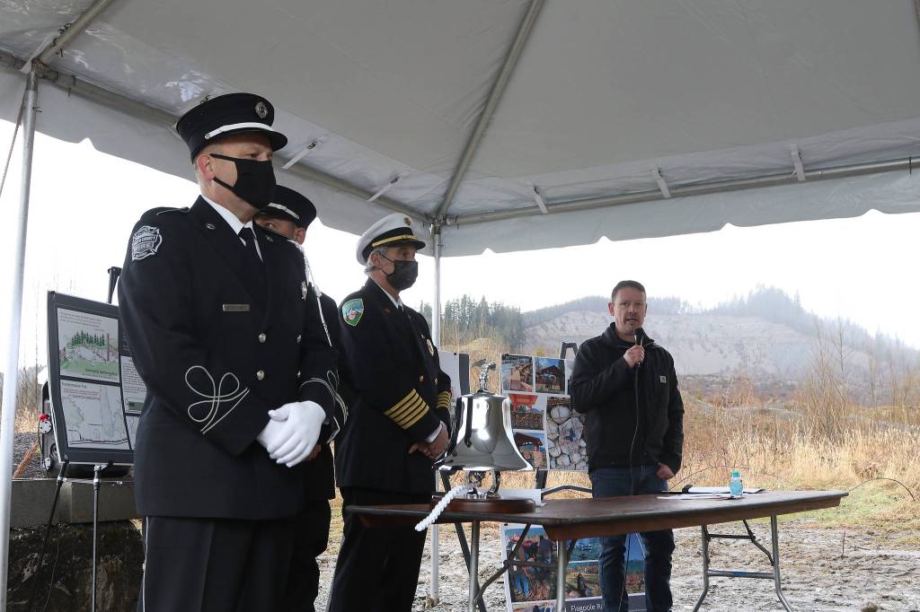 Dayn Brunner talks about his sister, Summer Raffo, who was killed in the Oso landslide seven years ago. A memorial for the victims was held at the site on Monday. (Andy Bronson / The Herald)
