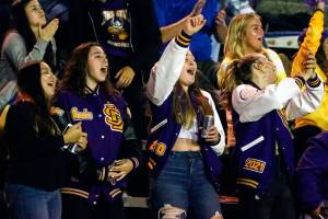Vikings fans cheer the action on the field Friday night at Lincoln Bowl in Tacoma on September 13, 2019. Lake Stevens won 35-26.  (Kevin Clark / The Herald)