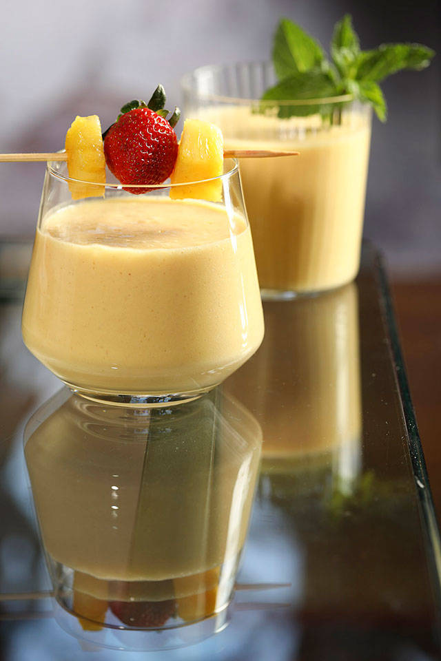 With a hit of rum, a tropical fruit smoothie becomes the perfect ending to your homebound spring break. (Abel Uribe / Chicago Tribune)