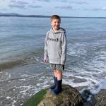 Blake Lewis, 7, at Bush Point where he threw a message in a bottle out to sea. Ruth Smethers later picked it up in Port Townsend. (Jessie Lewis)