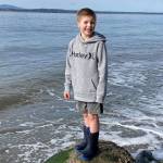 Blake Lewis, 7, at Bush Point where he threw a message in a bottle out to sea. Ruth Smethers later picked it up in Port Townsend. Photo provided by Jessie Lewis