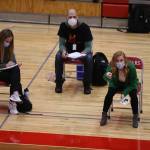 Monroe Head Coach Nicole Hayes, right, gives instructions to her players as Stanwood took on Monroe in a volleyball game on Wednesday, March 17, 2021 in Stanwood, Washington. (Andy Bronson / The Herald)