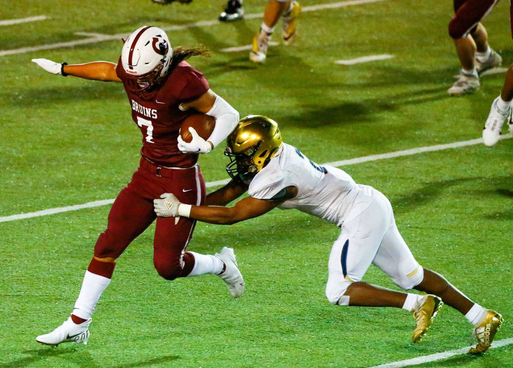 The annual Battle of Broadway between Everett High and Cascade High at Everett Memorial Stadium Friday night on March 19, 2021. (Kevin Clark / The Herald)