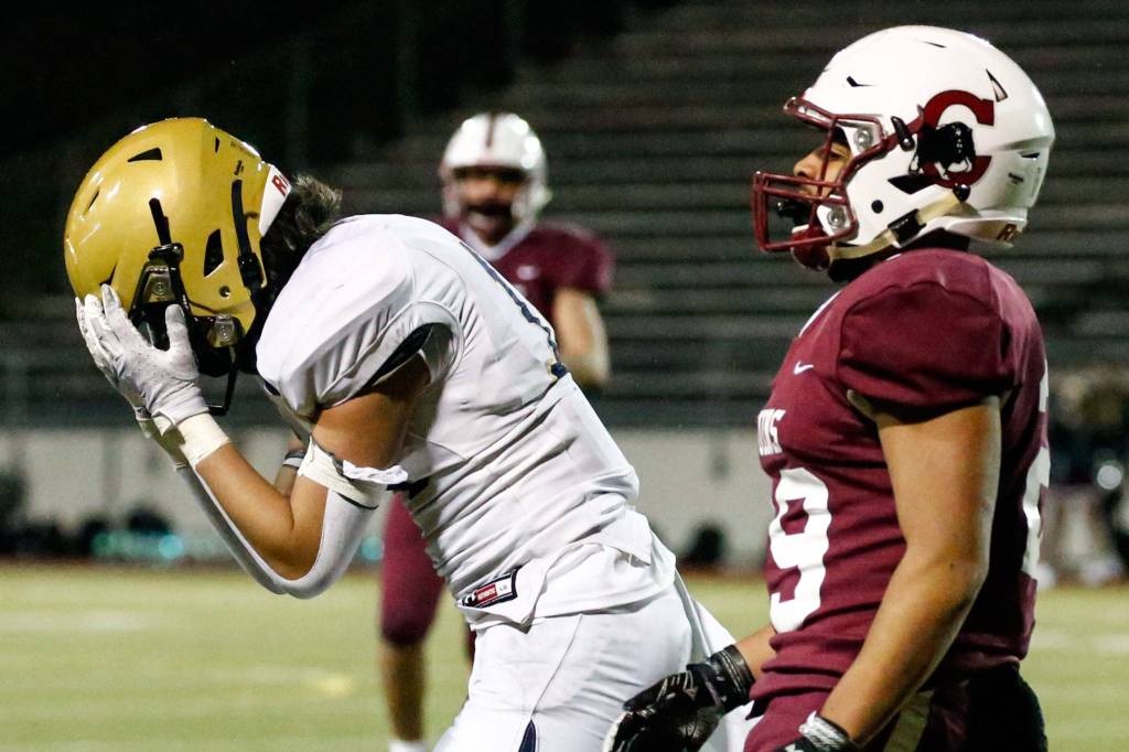 The annual Battle of Broadway between Everett High and Cascade High at Everett Memorial Stadium Friday night on March 19, 2021. (Kevin Clark / The Herald)