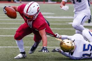 The annual Battle of Broadway between Everett High and Cascade High at Everett Memorial Stadium Friday night on March 19, 2021. (Kevin Clark / The Herald)