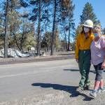 Washington Commissioner of Public Lands Hilary Franz, left, walks around the town of Malden with Mayor Chris Ferrell, right, Wednesday, Sept. 9, 2020 in Malden, Wash. Franz toured the town and made the case for more funding for firefighting resources. Most of the buildings in Malden, which is about five miles west of Rosalia, were destroyed by wind-driven wildfire on Labor Day. (Jesse Tinsley/The Spokesman-Review via AP)