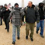 In this Jan. 6 photo, Proud Boys including Joseph Biggs (left) and Ethan Nordean (with megaphone) walk toward the U.S. Capitol in Washington, in support of President Donald Trump. (AP Photo/Carolyn Kaster, file)