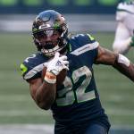 Seattle Seahawks running back Chris Carson runs with the during the second half of an NFL football game against the New York Jets, Sunday, Dec. 13, 2020, in Seattle. The Seahawks won 40-3. (AP Photo/Stephen Brashear)