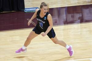 BYU's Paisley Harding (13) celebrates after BYU defeated Rutgers in a college basketball game in the first round of the women's NCAA tournament at the University Events Center in San Marcos, Texas, Monday, March 22, 2021. BYU defeated Rutgers 69-66.(AP Photo/Chuck Burton)