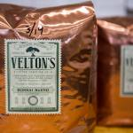 Bags of Everett roasted coffee from Veltons Coffee Roasting Co. are displayed on the counters Thursday at Milk House Coffee Co. in Everett. (Olivia Vanni / The Herald)