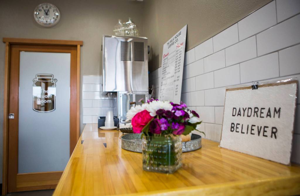 A sign reading Daydream Believer sits on display Thursday at Milk House Coffee Co. in Everett. (Olivia Vanni / The Herald)
