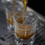 Shots of coffee fill up from a Synesso Seattle-built espresso machine Thursday at Milk House Coffee Co. in Everett. (Olivia Vanni / The Herald)