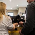 Heather and Michael Wallace make cappuccinos Thursday at Milk House Coffee Co. in Everett. (Olivia Vanni / The Herald)