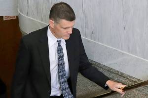 Former Washington state Auditor Troy Kelley, right, arrives at the federal courthouse in Tacoma, Wash., with his wife Diane, left, Friday, June 29, 2018, for a sentencing hearing following his conviction in 2017 on several charges related to when he ran a real-estate escrow services business during the height of last decade's housing boom. (AP Photo/Ted S. Warren)
