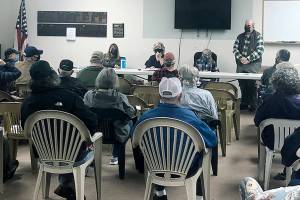 Photo by Emily Gilbert/Whidbey News-Times
Judy Thorpe, left, Tracy Weissel, Sarah Westcott and Michael Thorpe listen to the audience during a community meeting at the Central Whidbey Sportsmen's Association in Coupeville last Friday, March 19. About 40 people came to the meeting to discuss their concerns about the Whidbey Homeless Coalition's proposed emergency overnight shelter on Morris Road in the former Jehovah's Witness building.