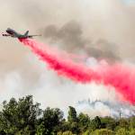 The Global Supertanker drops retardant while battling the Glass Fire in Napa County, California, on Sept. 27, 2020. (AP Photo/Noah Berger, file)