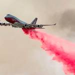 The Global Supertanker drops retardant while battling the Glass Fire in Napa County, Calif., on Sunday, Sept. 27, 2020. (AP Photo/Noah Berger)
