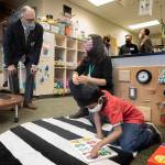 Washington Governor Jay Inslee speaks with special ed Pre-K teacher Michelle Ling in her classroom at Phantom Lake Elementary School in Bellevue on March 2. (Ellen M. Banner/The Seattle Times via AP)