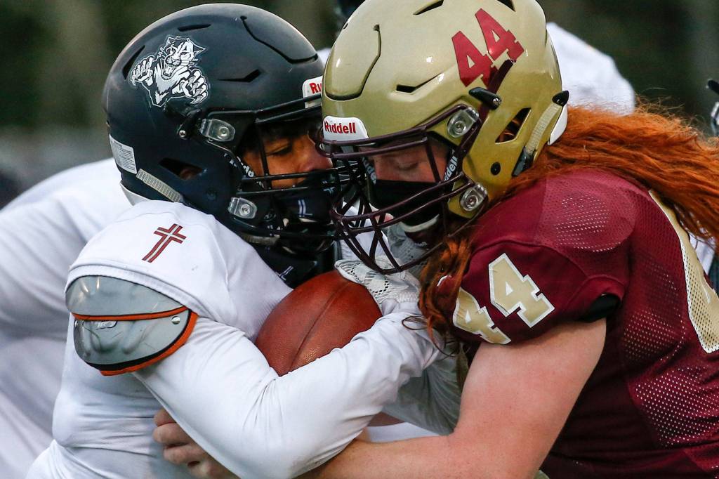 The Lakewood Cougars defeated the visiting Archbishop Murphy Wildcats 32-21 at Lakewood High Friday night in Arlington on March 26, 2021. (Kevin Clark / The Herald)