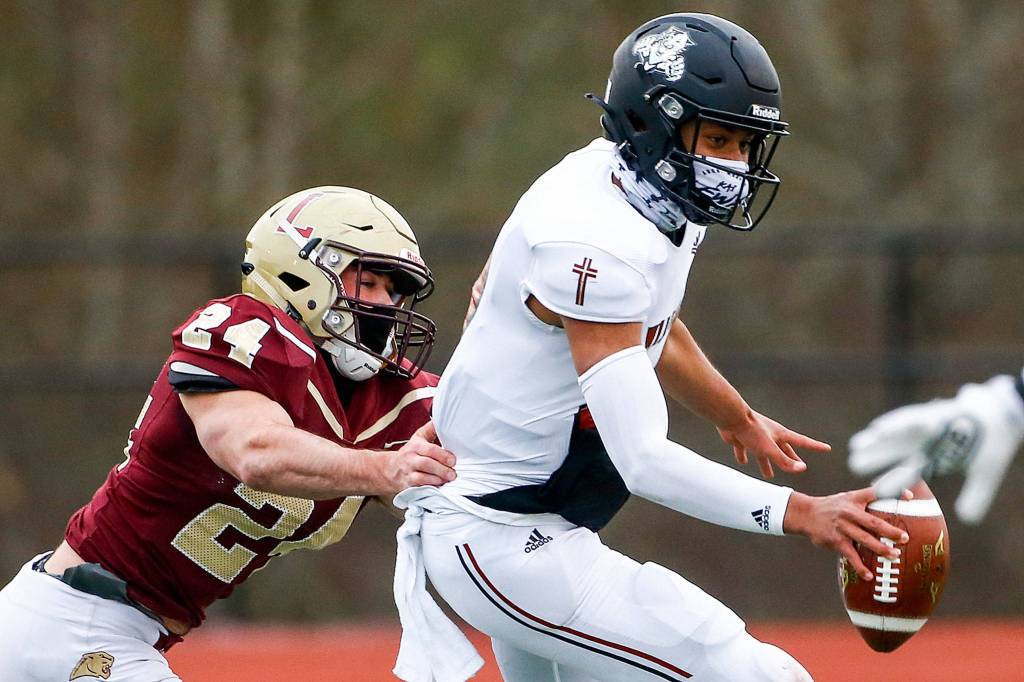 The Lakewood Cougars defeated the visiting Archbishop Murphy Wildcats 32-21 at Lakewood High Friday night in Arlington on March 26, 2021. (Kevin Clark / The Herald)