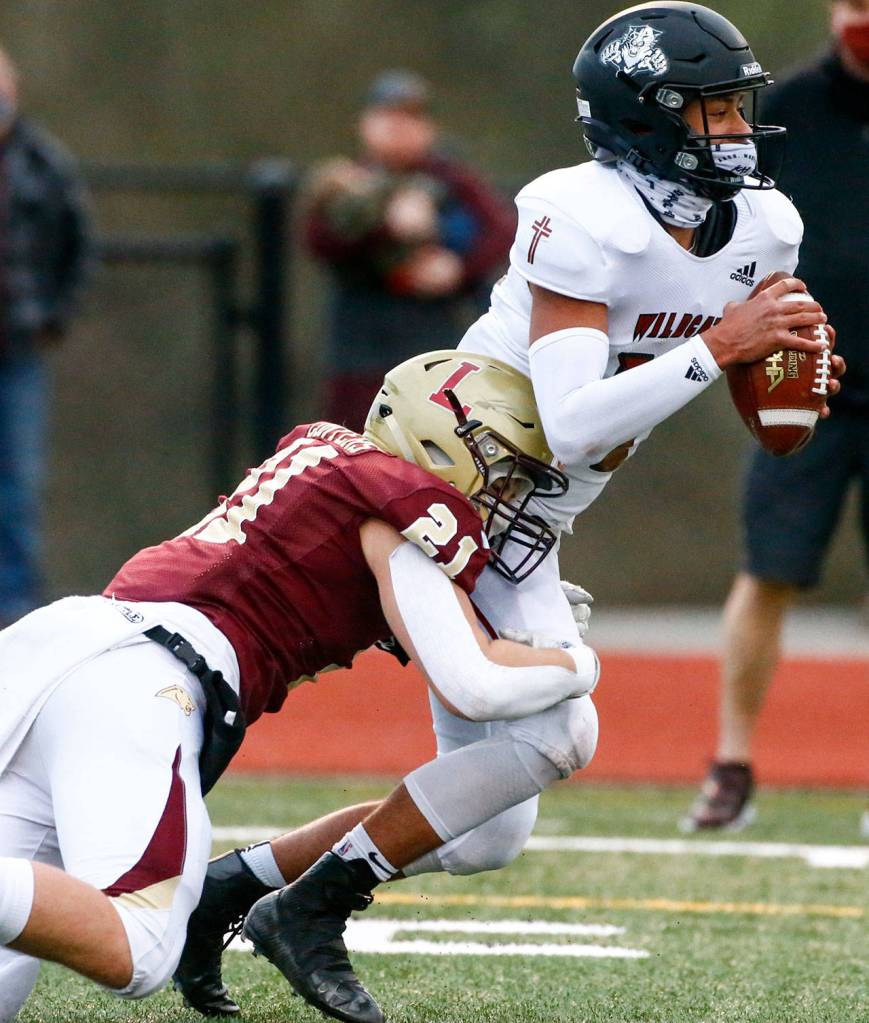 Blake Conyers (21) and the Lakewood defense allowed just 210 total yards. (Kevin Clark / The Herald)