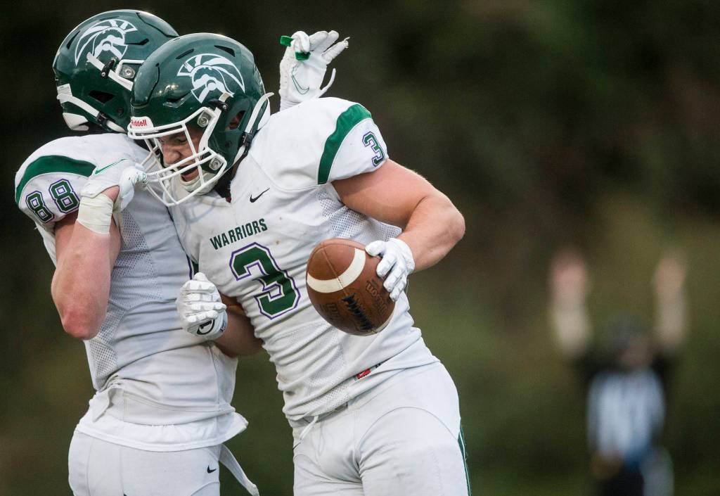 Edmonds-Woodways Ryan Fahey celebrates a touchdown with Isaac Wicks during the game on Friday, March 26, 2021 in Edmonds, Wa. (Olivia Vanni / The Herald)