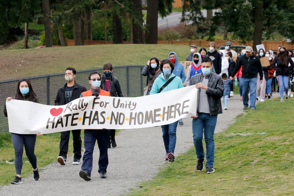 People march in unity with and support of Asian and Pacific Islander communities Saturday morning at Esperance Park in Edmonds. (Kevin Clark / The Herald)