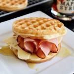 A drizzle of real maple syrup gives a ham and cheese waffle sandwich a sweet finish.(Gretchen McKay/Pittsburgh Post-Gazette/TNS)