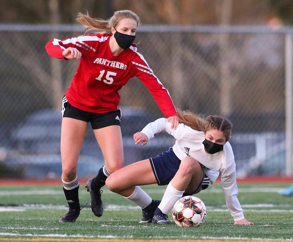 Snohomishs Alex Prescott and Glacier Peaks Cheyenne Rodgers try to get to the ball during a girls soccer match at Veterans Memorial Stadium on Monday in Snohomish. (Andy Bronson / The Herald)