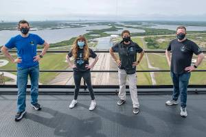 In this photo provided by SpaceX, Jared Isaacman, from left to right, Hayley Arceneaux, Sian Proctor and Chris Sembroski pose for a photo, Monday, March 29, 2021, from the SpaceX launch tower at NASA’s Kennedy Space Center at Cape Canaveral, Fla. (SpaceX via AP)