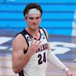 Gonzaga forward Corey Kispert, an Edmonds native, hold up four fingers after beating USC 85-66 in the Elite Eight of the mens college basketball tournament on Tuesday at Lucas Oil Stadium in Indianapolis. (AP Photo/Michael Conroy)