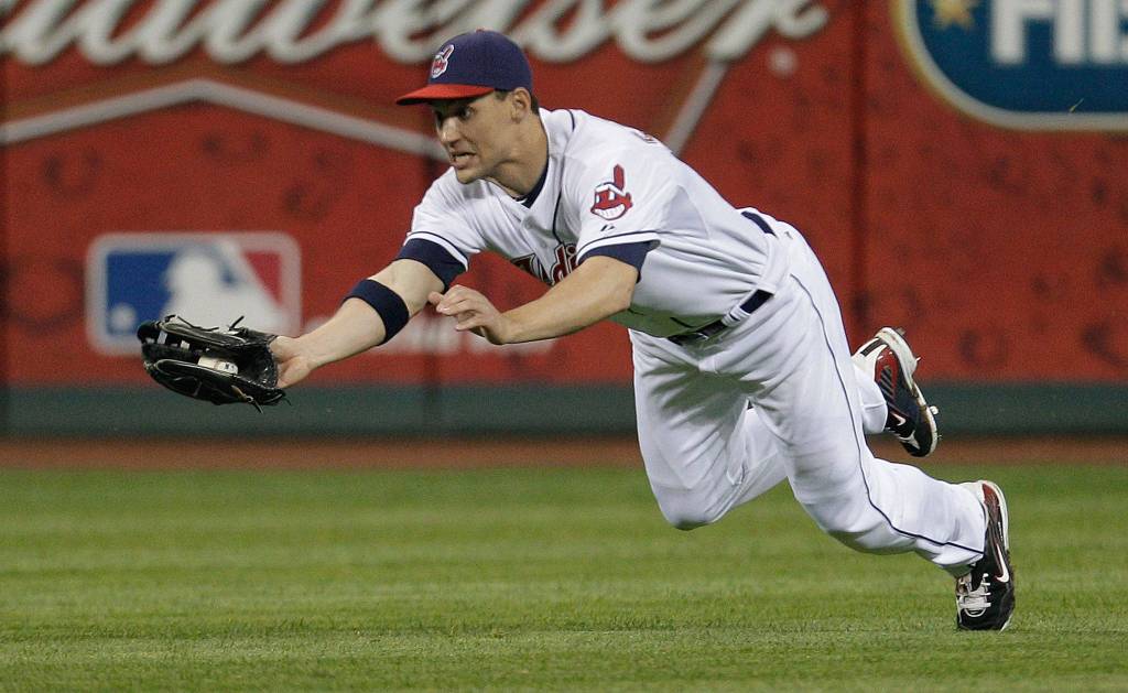Cleveland Indians center fielder Grady Sizemore, a Cascade High School alum, dives to catch a fly ball during a game against the Kansas City Royals in 2011 in Cleveland. (AP Photo/Amy Sancetta)