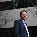Snehal Patel, Global Head of Cell Therapy Manufacturing at Bristol Myers Squibb, stand outside the facility on Monday, March 29, 2021 in Bothell, Washington. A Bristol Myers Squibb facility in Bothell is one of four facilities in the United States where the company supercharges a person's T-cells to better fight blood cancers. The facility uses a virus  -- a viral delivery system -- to add punch to an individual's T-cells. The T-cells are then returned to the person better-equipped to destroy cancer cells.  (Andy Bronson / The Herald)