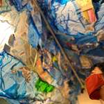 Amber Vincini looks up at The Wave installation by Maria Phillips.