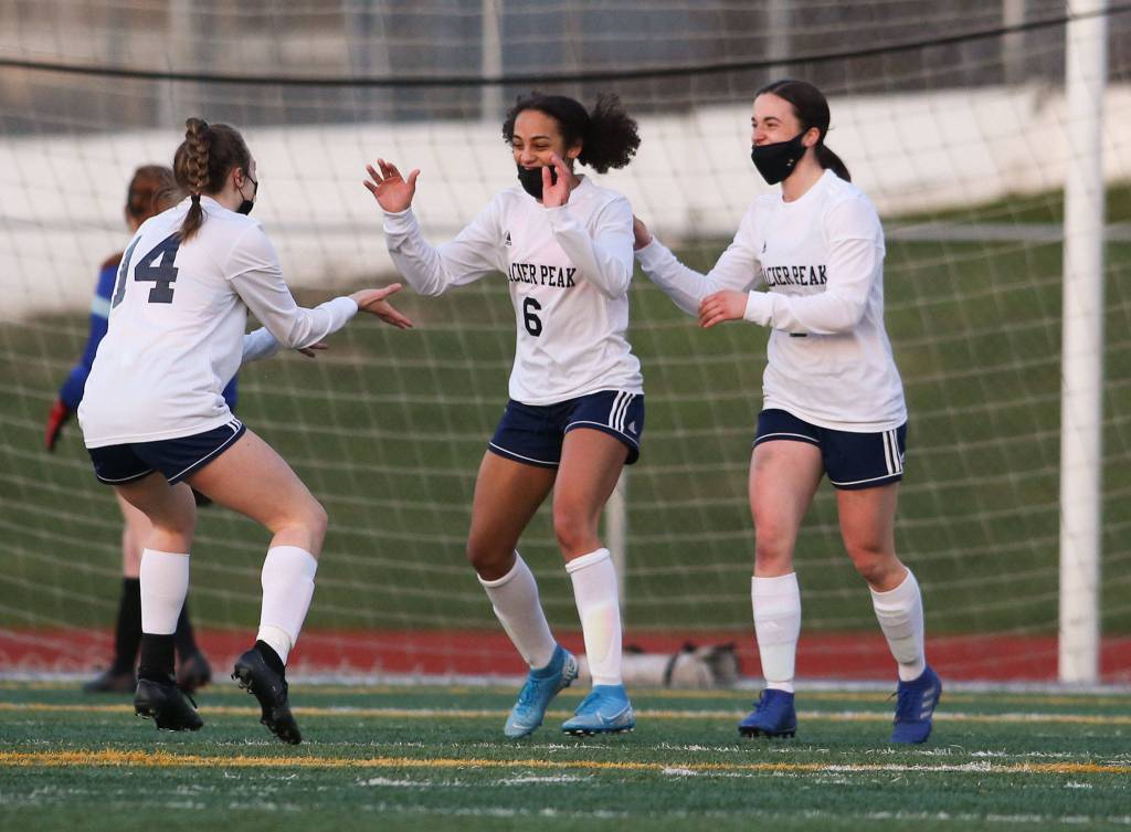 Glacier Peaks Aaliyah Collins (6) celebrates her goal with teammates during a March 29 match against Snohomish at Veterans Memorial Stadium in Snohomish. (Andy Bronson / The Herald)
