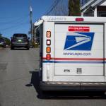 Two cars navigate narrow West Ibberson Drive on March 10 in Everett. The city had proposed to put a pedestrian trail along the road but removed the segment after neighbors criticized the route. (Olivia Vanni / The Herald)