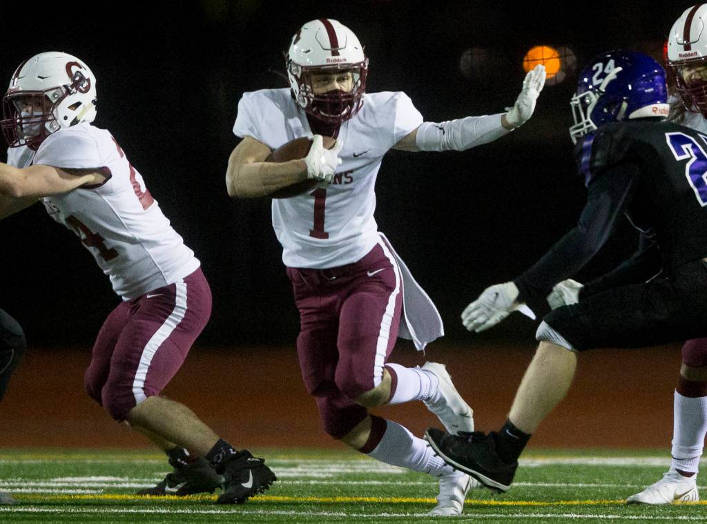Cascades Michel Purl runs the ball during a game against Kamiak on April 1, 2021, in Everett. (Olivia Vanni / The Herald)