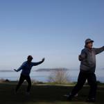 Dongyue Zhuang and Hong Li go through a section of tai chi movements at Harborview Park on Tuesday in Everett. (Olivia Vanni / The Herald)