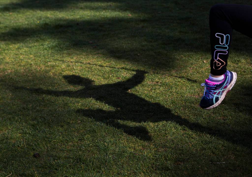 Dongyue Zhuang does tai chi sword movements Tuesday in Everett. (Olivia Vanni / The Herald)
